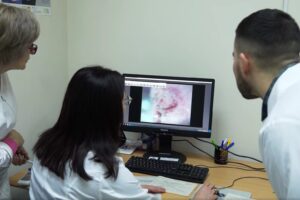 Doctors looking at a screen