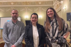 One man and two women in a row