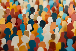 a paper cut of of a crowd of diverse people