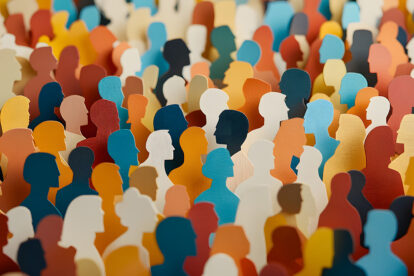 a paper cut of of a crowd of diverse people