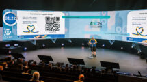 Man presenting on a large stage