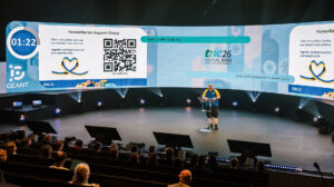 Man presenting on a large stage