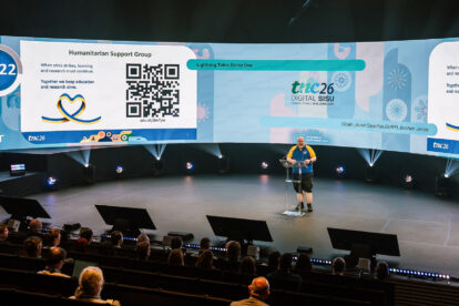 Man presenting on a large stage